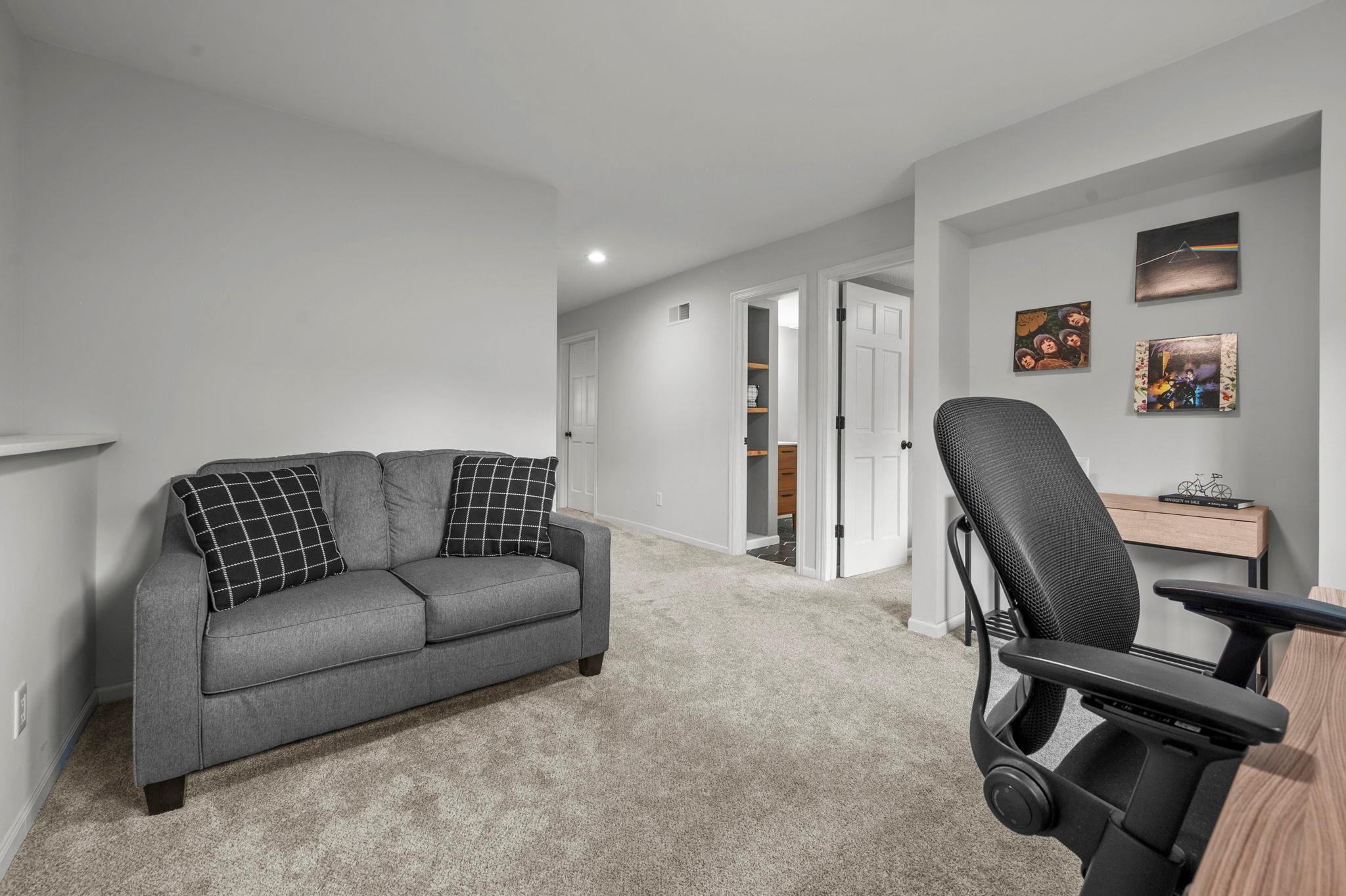Lower level has full laundry room with newer washer, dryer and tiled floor, laundry sink and faucet. Water heater-2021, radon mitigation system-2024, additional electrical sub-panel-2022, roof-2020, new carpet & electric fireplace and mantel-2022.