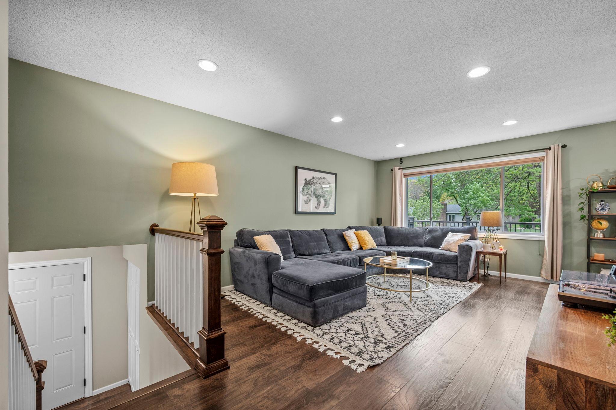 Beautiful flooring throughout the home! Nice huge windows in the living room and canned lighting.