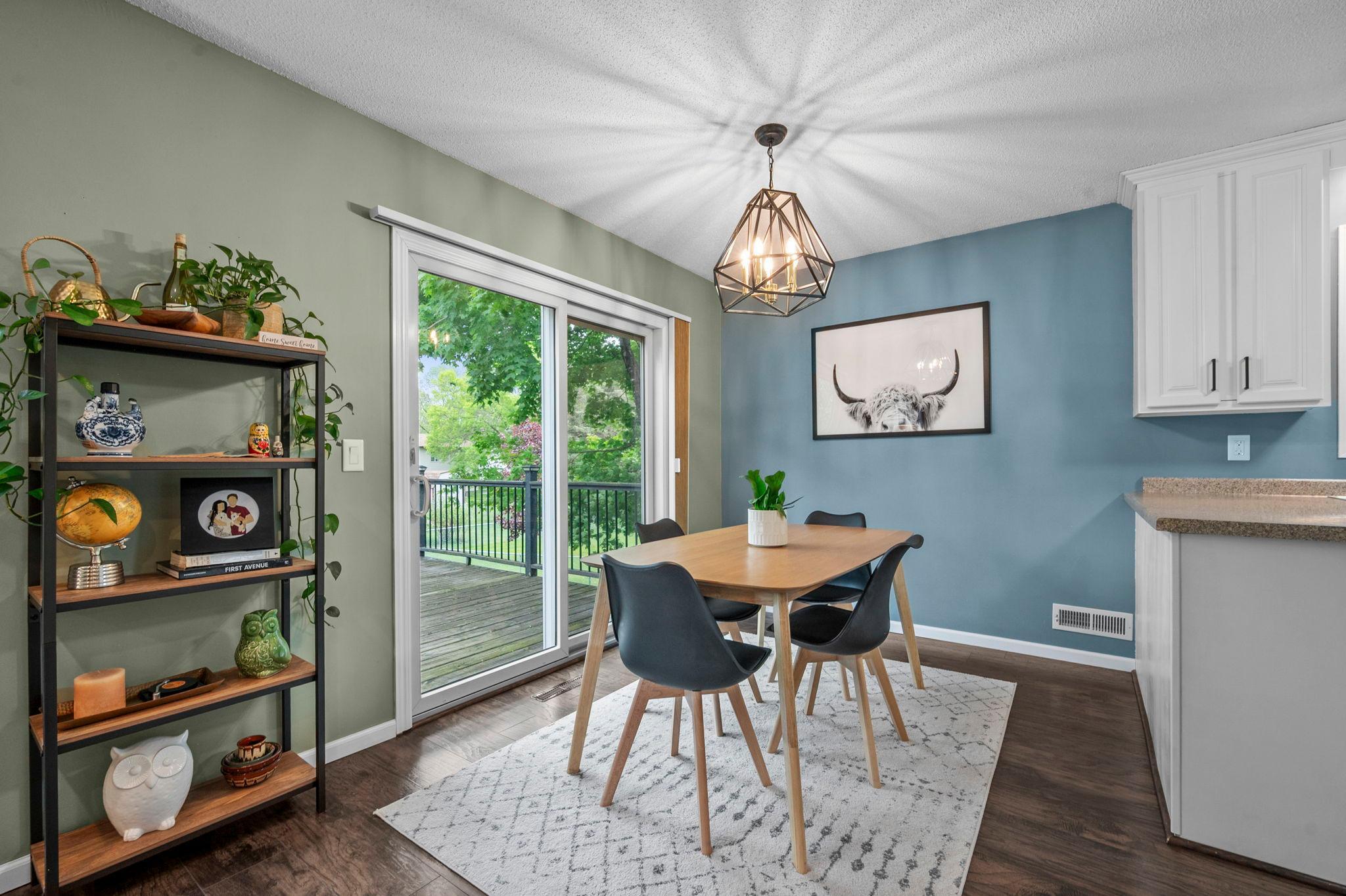 New lighting in informal dining room. The sliding glass door gives access to the huge 28 x 14 deck for all your entertaining needs.