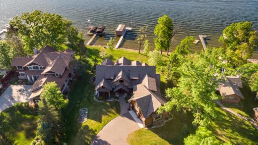 Bird’s-eye view of front entry, driveway, and lakeside location.