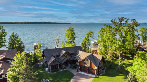 Breathtaking lakefront estate with private dock, pristine shoreline, and custom architectural details throughout.