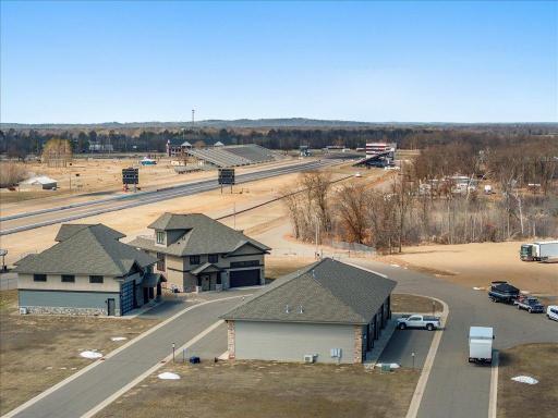 Bird’s-eye view of garage complex and main road access.