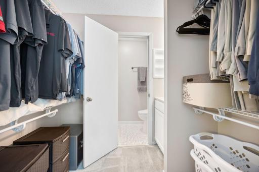 Walkthrough primary closet to private 3/4 bath