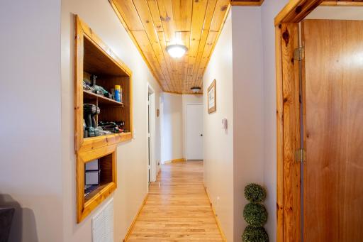 Hallway to Bedrooms with built in storage