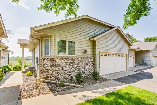 Enjoy living in this spacious townhome backed up to green space and a short walk to White Bear Lake.