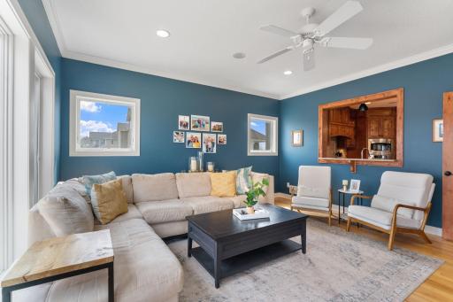 The light filled sun room provides additional living space, conveniently located off the kitchen and dining spaces.