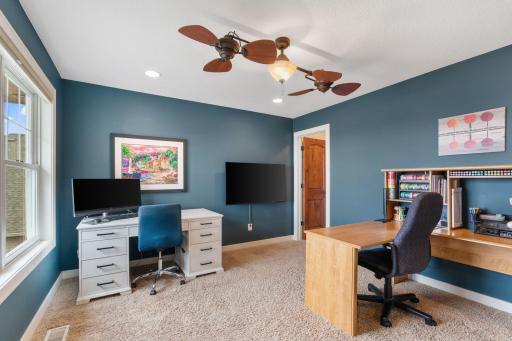 The 2nd of 4 bedrooms on the upper level currently serving as a home office.