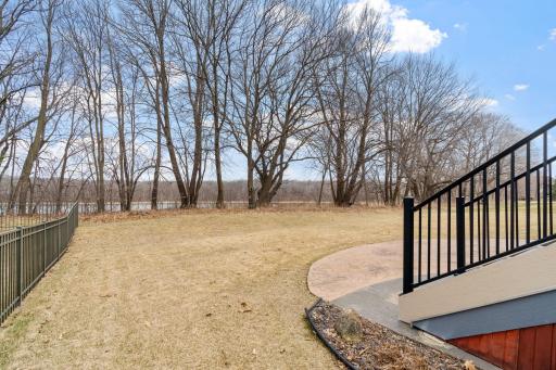 An invisible fence provides peace of mind for pets while also keeping the view of the pond open.
