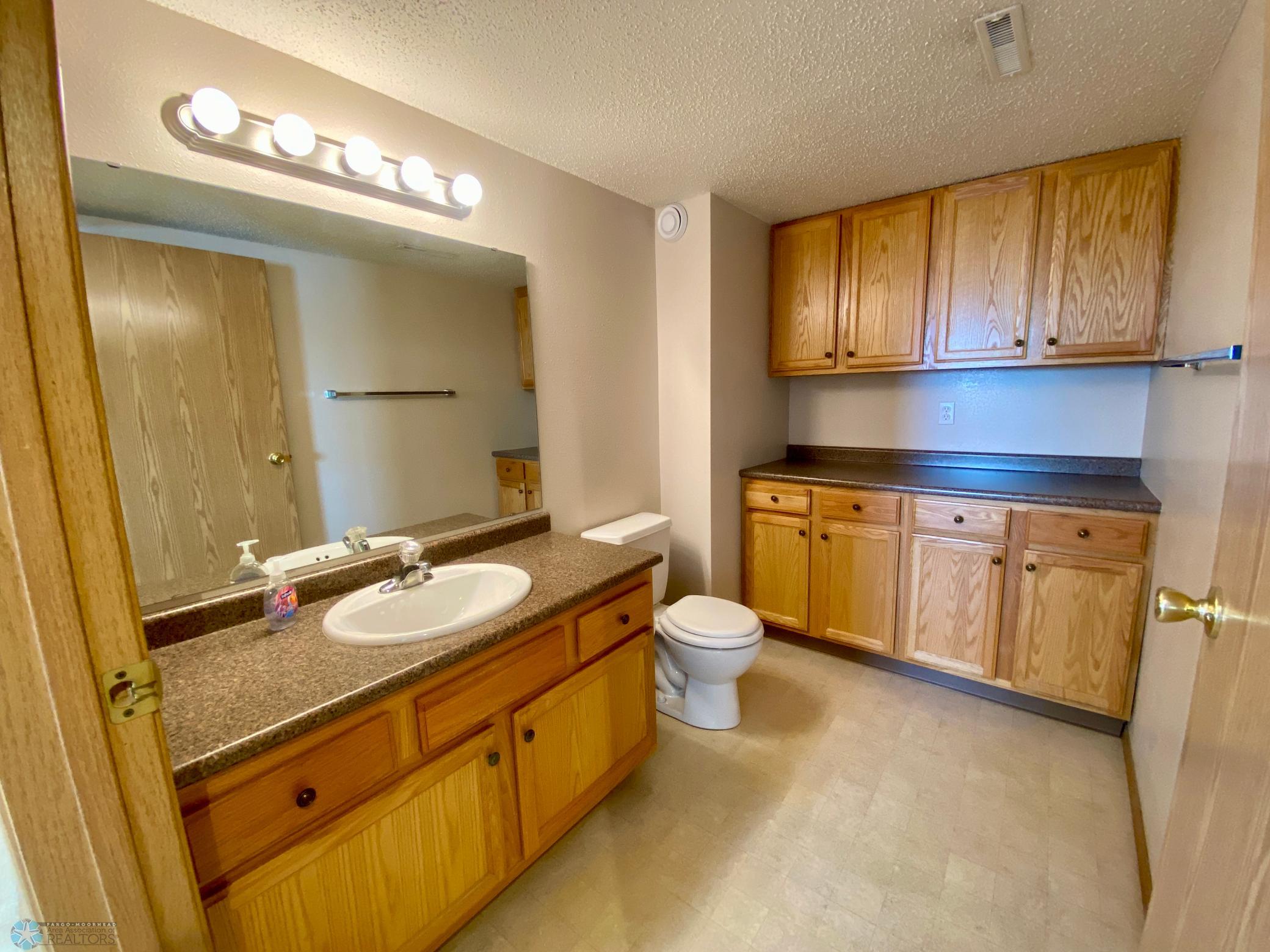 half bath/RI for shower behind cabinets