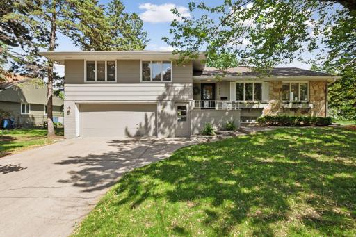 Beautiful split-level home on a spacious, tree-lined lot in the quiet, established Lake Edina neighborhood.