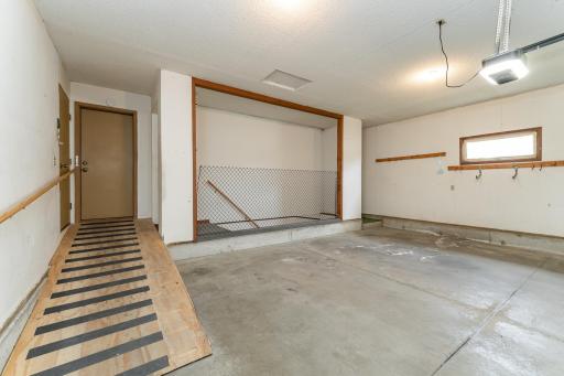 Oversized 2-car garage with ramp and separate basement access