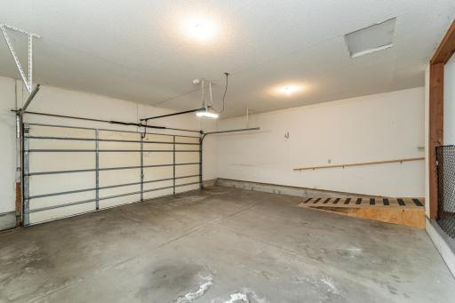 Oversized 2-car garage with ramp and separate basement access