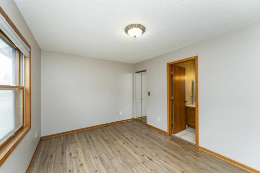 Primary bedroom attached bath and LVP flooring