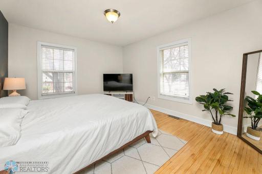 Primary suite with original hardwood floors