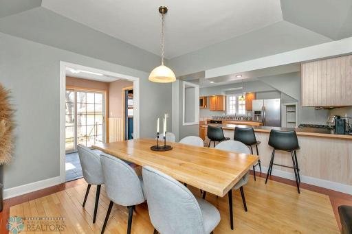 Dining to Kitchen & patio door entry to backyard