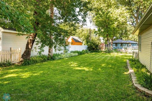 Large, fully fenced backyard & separately fenced garden.