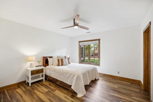 The lower level features two spacious bedrooms, each with walk-in closets and ample natural light.