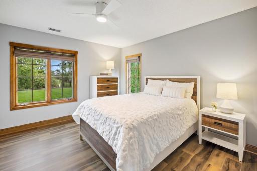 Perfect for guests or family, these rooms offer privacy and comfort just steps from a full bath and additional living spaces.
