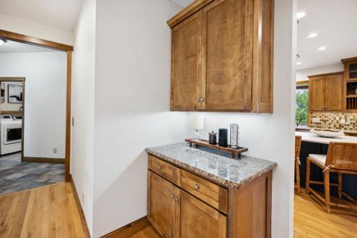 Tucked just off the kitchen, this versatile drop zone doubles as a stylish coffee bar.