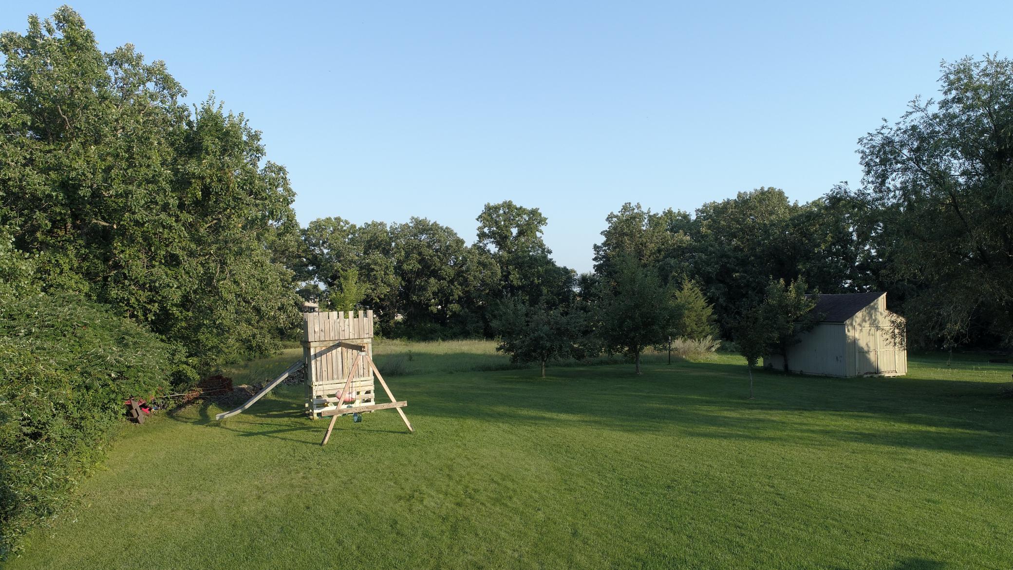 The 8-zone irrigation system & nice level green space makes this yard ideal for play & hosting events!