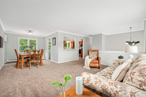 Open living room, dining room, and kitchen.