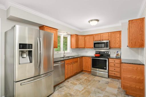 Kitchen with stainless steel appliances and granite countertops.
