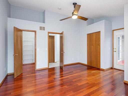 No shortage of storage in the primary bedroom! Two closets (one of them a walk-in), and space above both closets can be used for storage or decorative display.