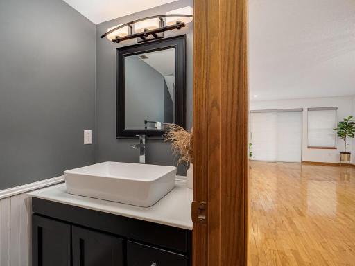 The main floor half-bath, conveniently located just off of the kitchen and living area.