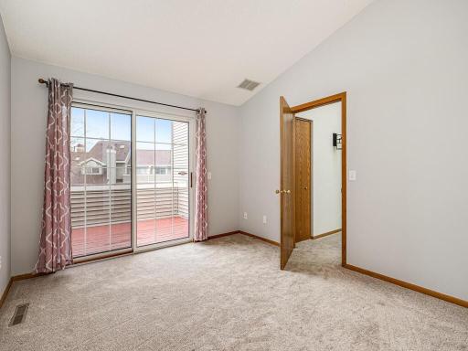 Second bedroom, also with walk-out access to the private balcony.