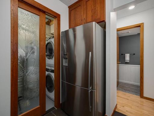 Convenient access to laundry and mechanicals through the stylish pocket door.