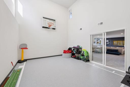 This impressive sport court offers year-round entertainment and can easily be used as a workout room.