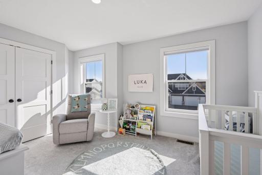 The 4th guest room offers 2 windows, carpeted flooring, recessed lights and a walk in closet and access to the Jack and Jill bathroom.