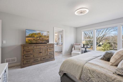 Access the primary bathroom to enjoy a private retreat.