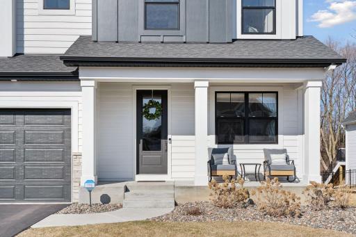 A welcoming front porch greets you, offering the perfect spot to relax and enjoy the neighborhood ambiance.