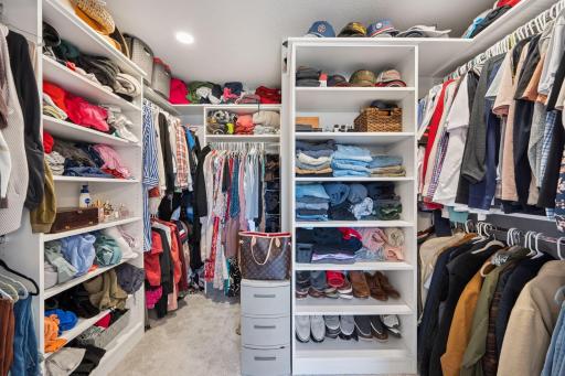 The California closet in the primary bedroom offers plenty of space to accommodate all your storage needs.