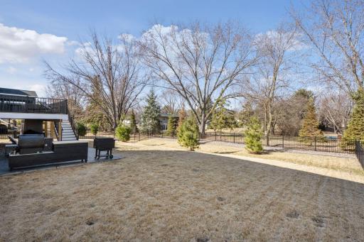 The fenced in yard also features a 5 zone irrigation system.