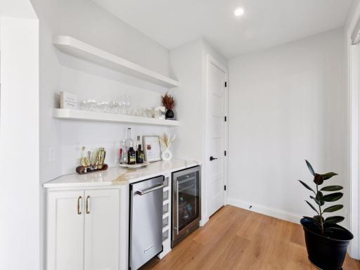 A convenient beverage bar - complete with a wine fridge and extra dishwasher - is ideal for entertaining.