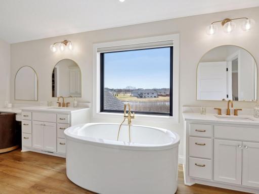 Relax in the soaking tub, with views of the property