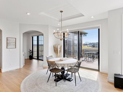 The informal dining area leads out to the deck with views of the property.