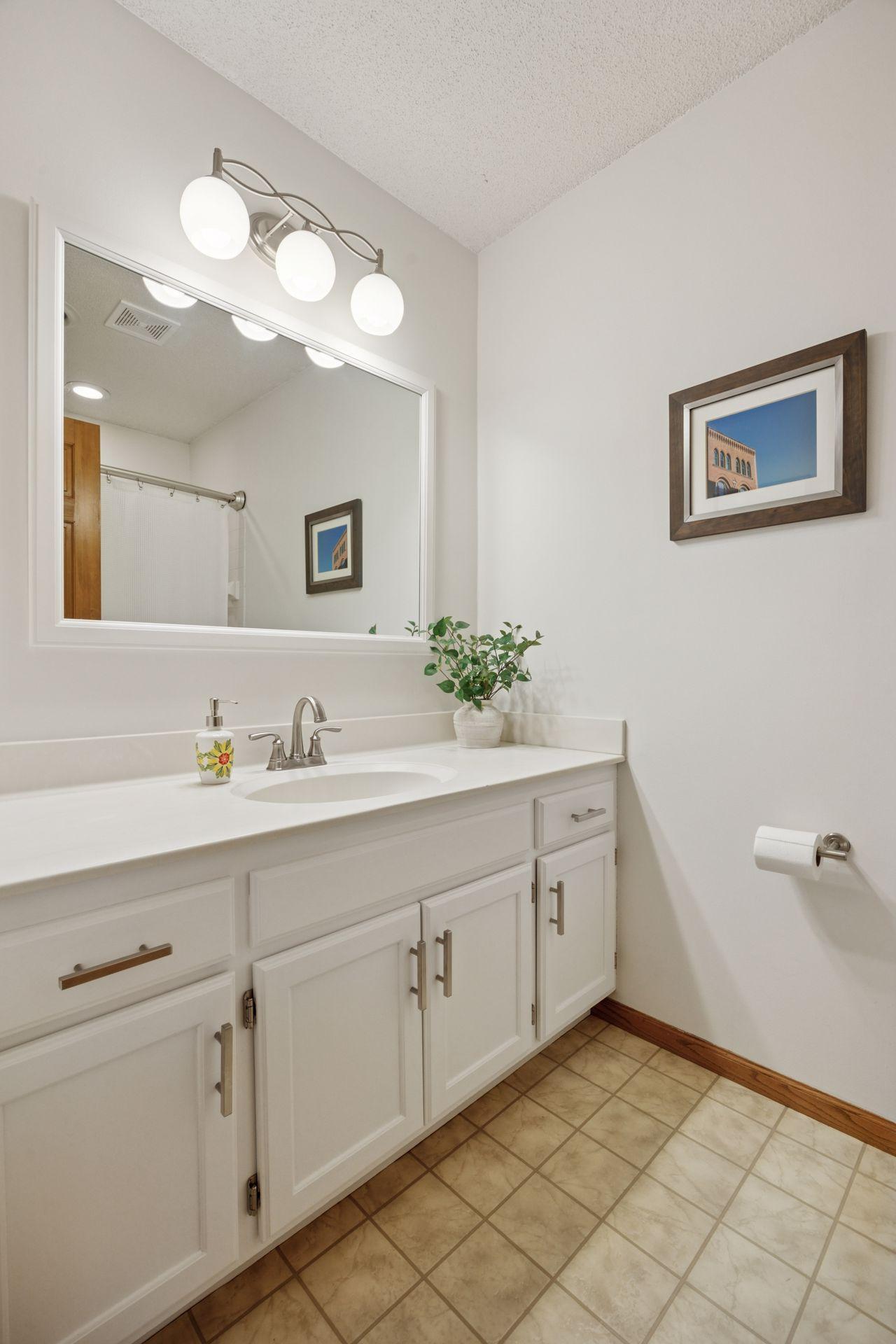 Upper Level Full Hall Bath with Replaced Hardware and Fixtures.