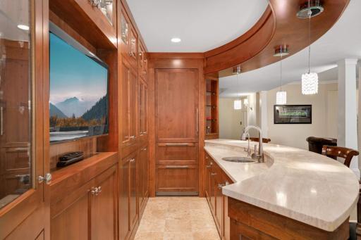 Custom wetbar with a secret. Built in refrigerator and freezers too.