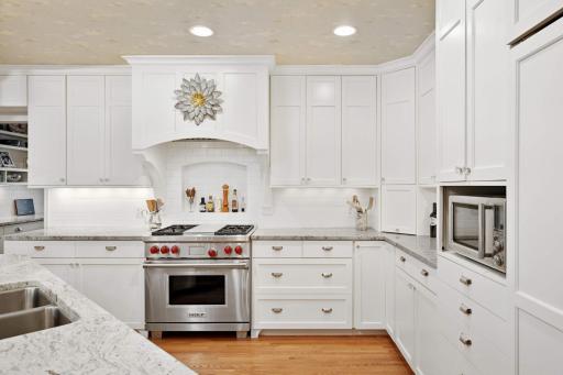 Perfect working triangle kitchen. Thoughtfully designed to be efficient while opening up to the front rooms.