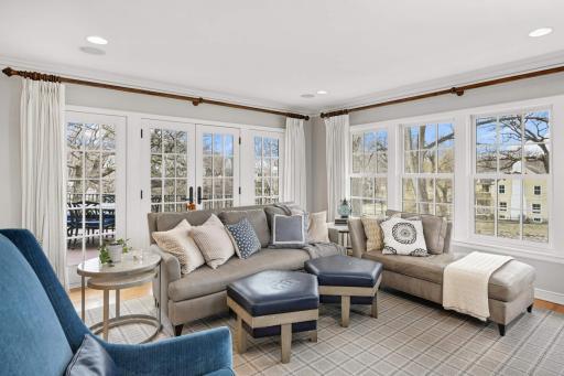 Feels like a 4 season porch. Walks out to the deck and opens to kitchen.