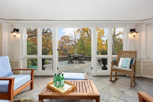 The screen porch is the center of attention in the summer!