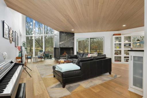Living room has vaulted ceilings and access to the covered porch.