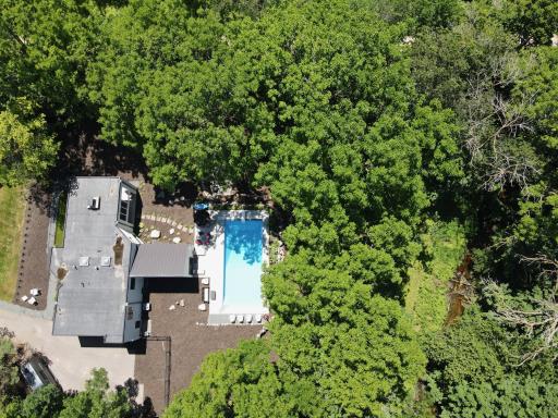 See open space next to creek. Has fire pit and ideal location for hockey rink!