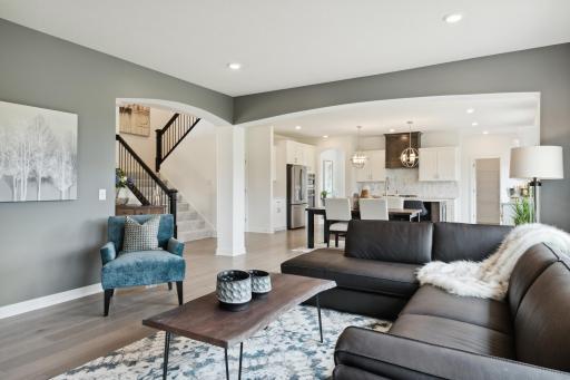 (Photo of model home, finishes will vary) As the heart of this home, the spacious Great Room offers an ideal space for relaxing with loved ones and creating cherished memories, with a charming center fireplace to add a special warmth.