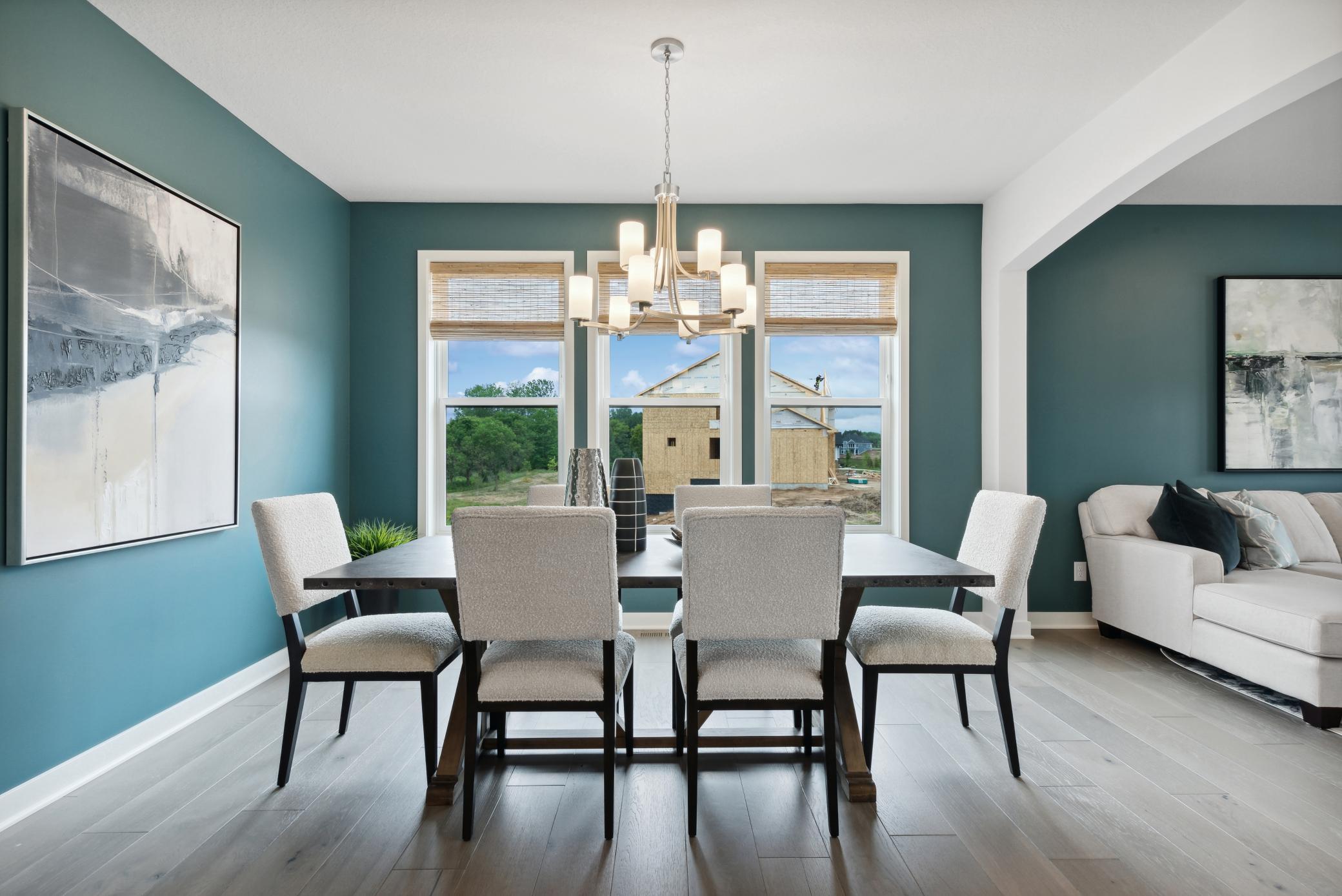 (Photo of model home, finishes will vary). Airy and bright, the formal dining room offers an atmosphere of casual elegance that helps make the simplest meal a memorable occasion.