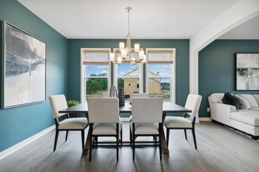 (Photo of model home, finishes will vary). Airy and bright, the formal dining room offers an atmosphere of casual elegance that helps make the simplest meal a memorable occasion.