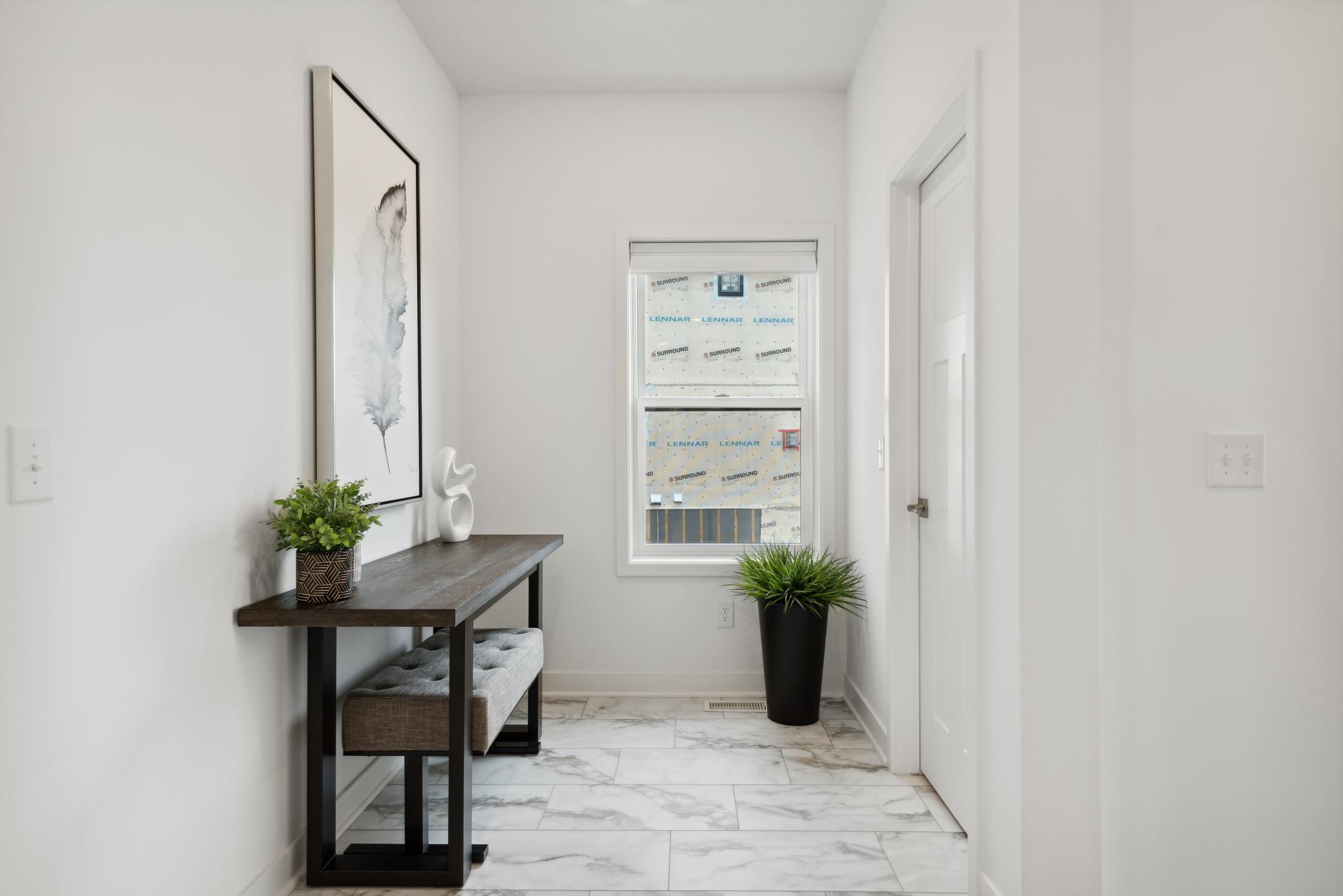 (Photo of model home, finishes will vary). The mudroom for shoe and jacket storage.